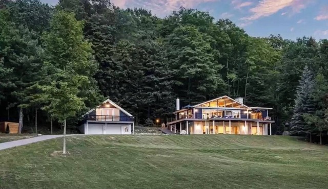 Spectacular view of Lake Michigan on wooded 37 acres access to beautiful beach