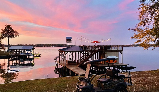 Two-story boathouse, golf cart, hot tub, kayaks, paddle boards, fishing lights!