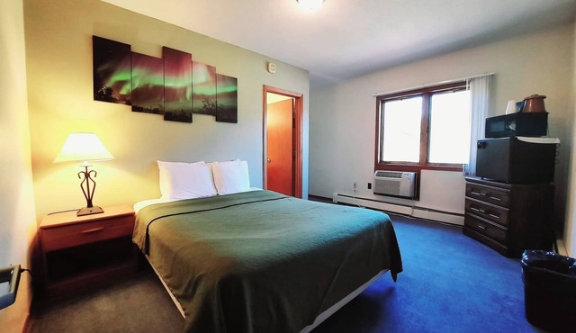 Unique Northern Lights Themed Guestroom inside the Lodge at North Ironwood Acres for up to Four people. 2 Queens, 2 Bathrooms. Dog Friendly resort!