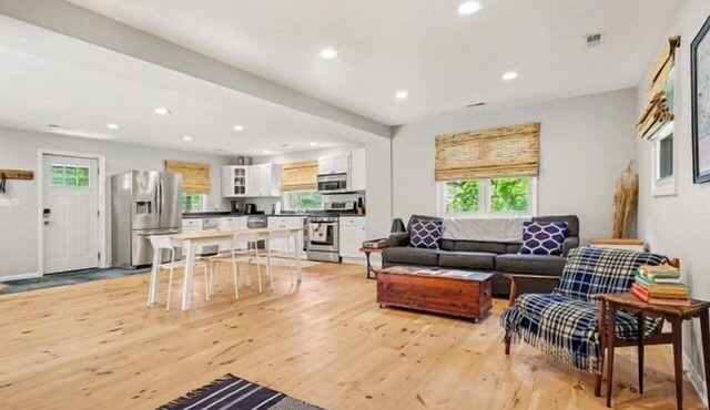 Welcome to Lake Breeze Cottage near Lake Michigan! This 2-bedroom, 2-bath home offers a king and queen bedroom, sofa couch, open-concept living space, and a private back patio for guest enjoyment.