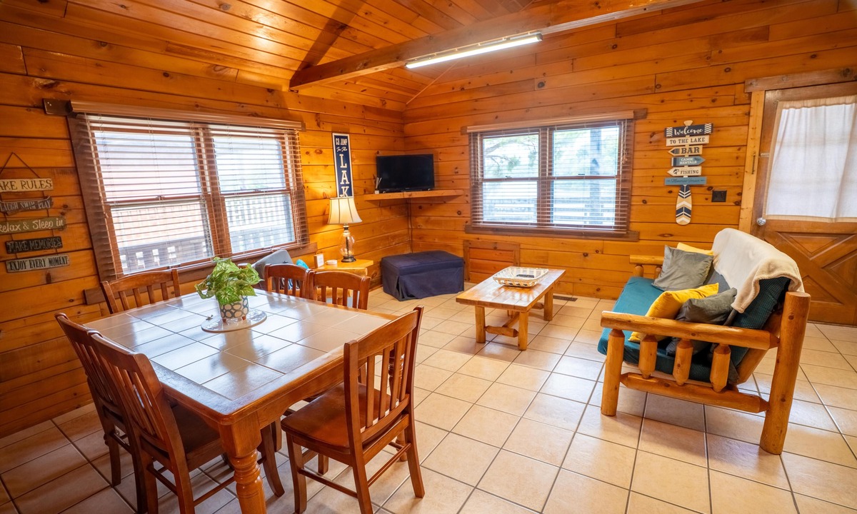 Eddyville Cabin | Sunrise Cove Log Cabin - Sunrise Cove is your perfect family escape on Lake Barkley! This charming log cabin offers two bedrooms, a sleeping loft, full kitchen, and bathroom with shower.