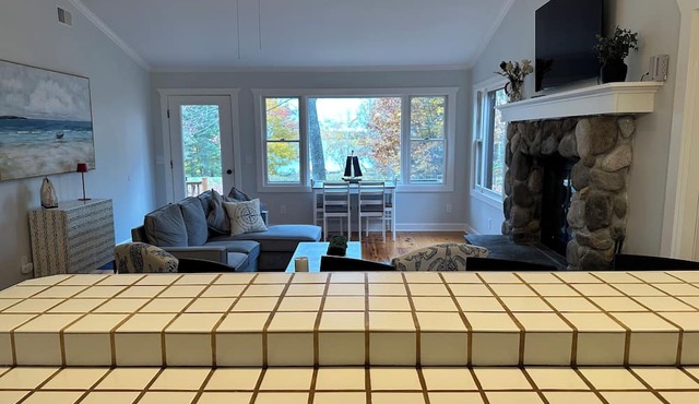 Private beachfront cottage, WiFi and AC on Lake Paradise, minutes from Mackinaw in Carp Lake