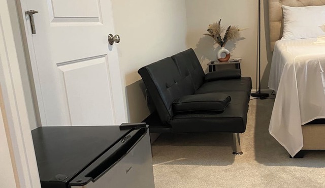 Primary bedroom and private bathroom space. Shared kitchen and dining area in Milford